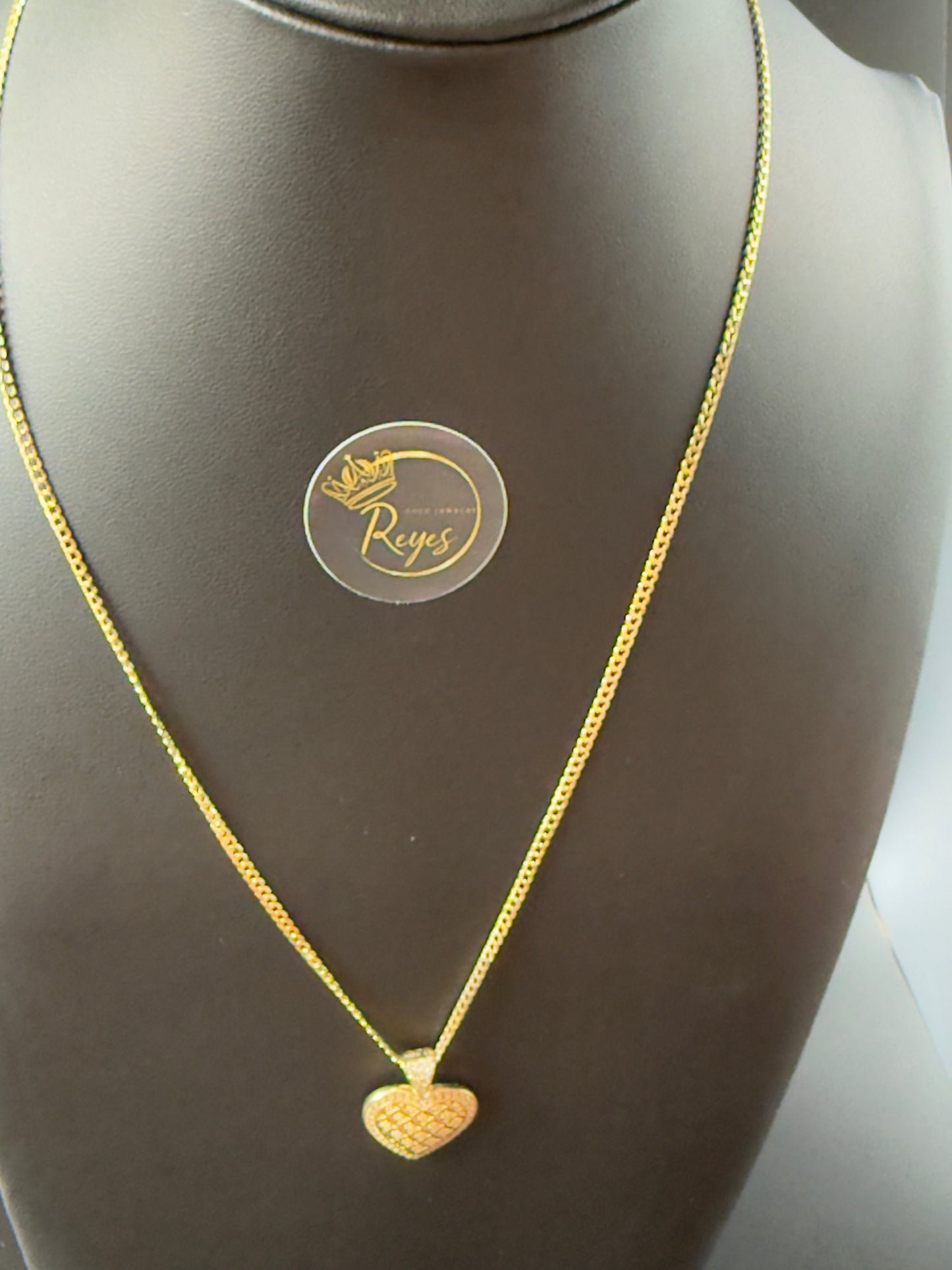 10K Cuban Solid Curb 18" 2mm with heart pendant.