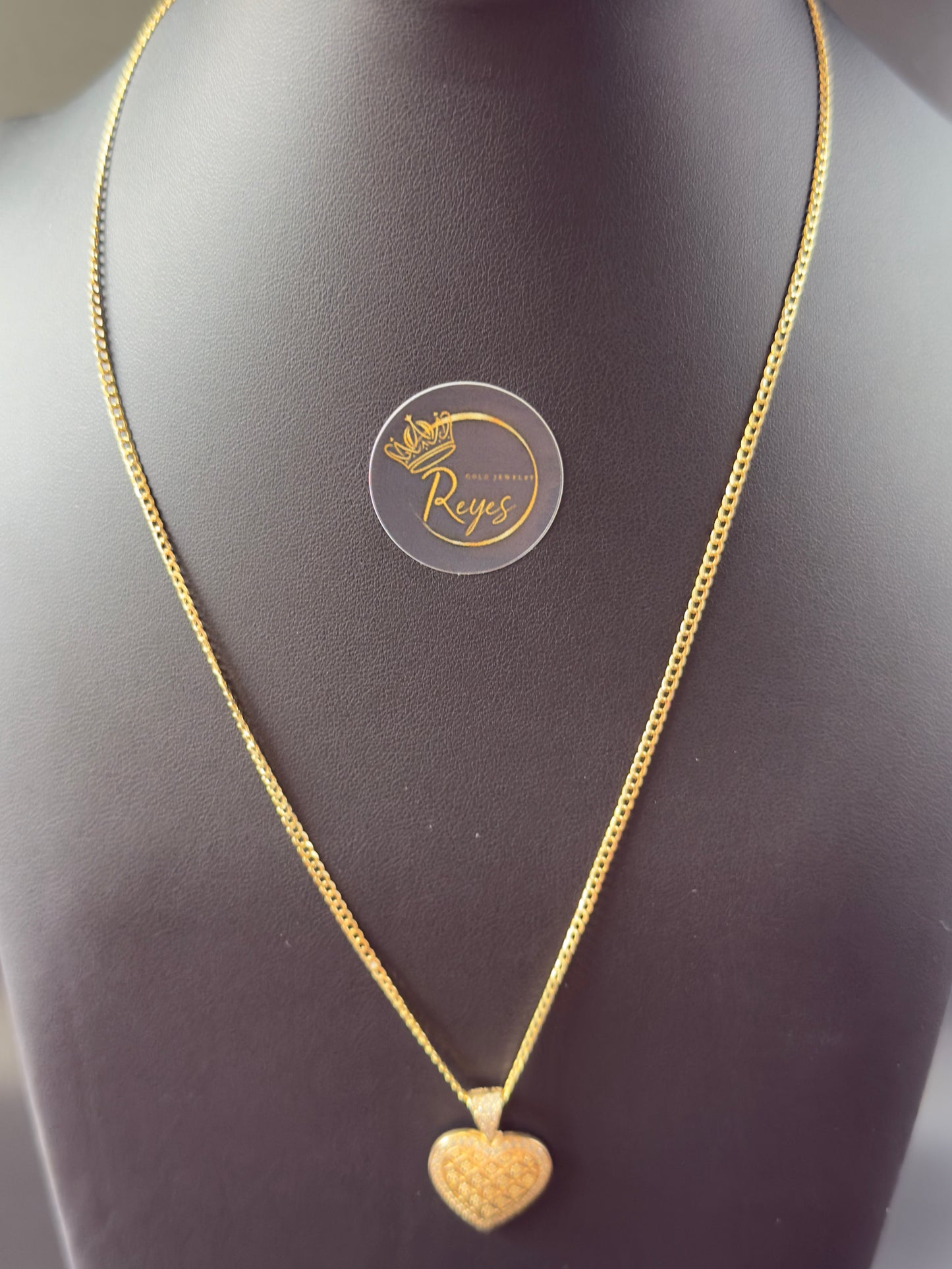 10K Cuban Solid Curb 18" 2mm with heart pendant.